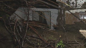 Wall of mud crashes into home in Encino