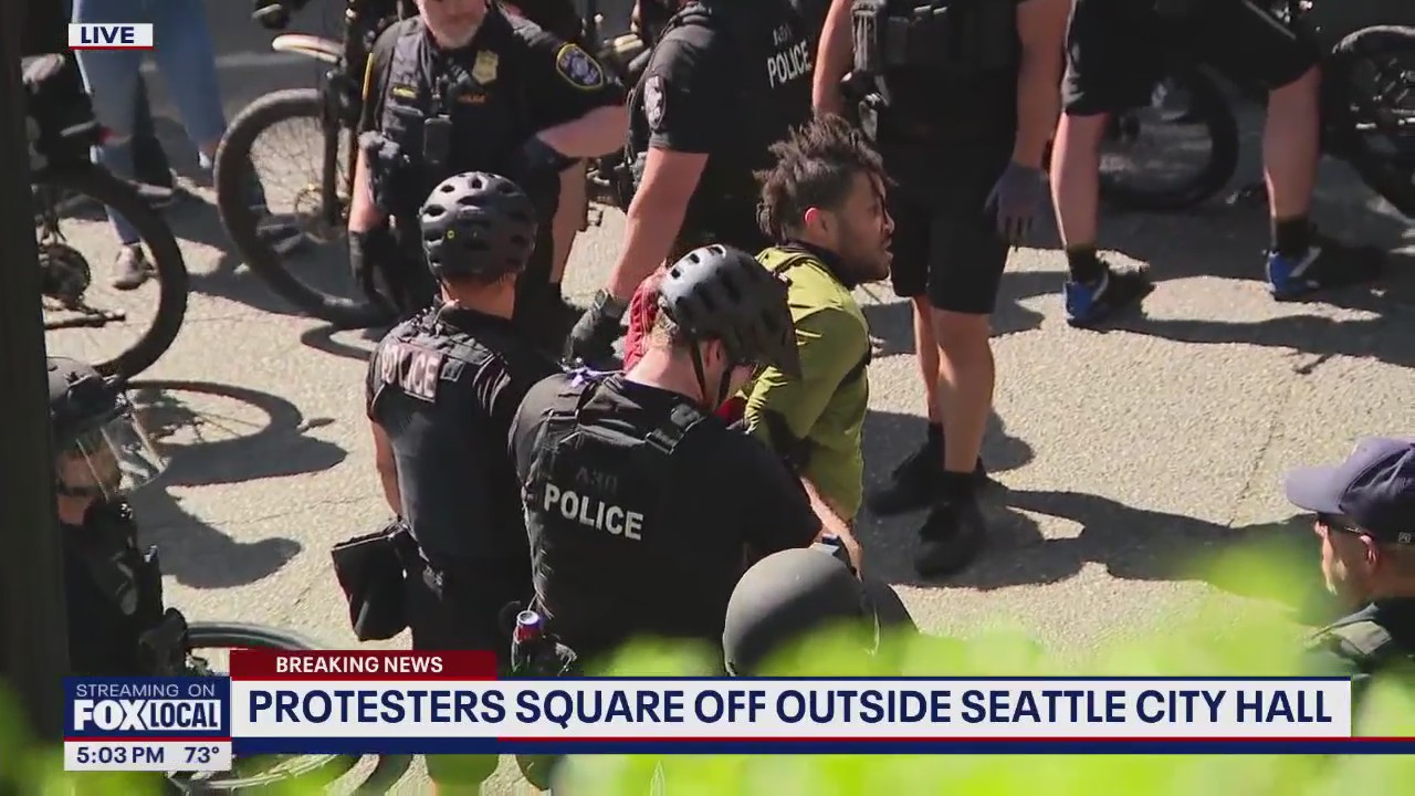 Seattle protesters square off outside City Hall