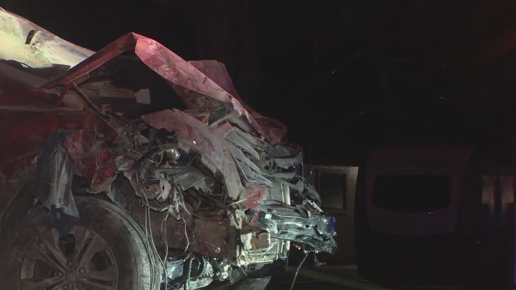 Four injured after car slams into home