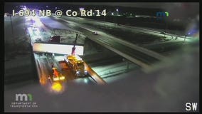 Trailer hangs over 694 overpass in Oakdale, Minn.