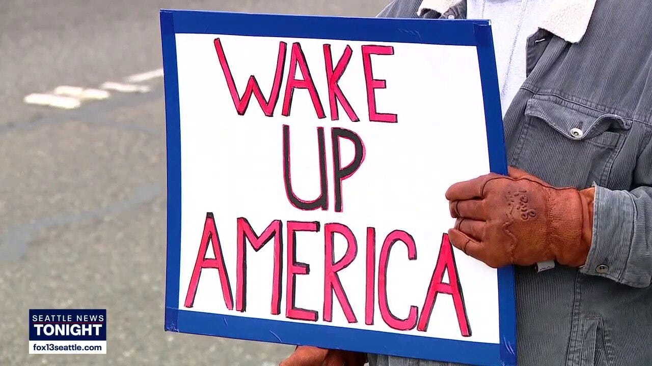 Protesters rally on Highway 99 in Lynnwood, WA calling to abolish ICE