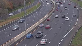 Dump truck strikes overhead highway sign, causing major impact