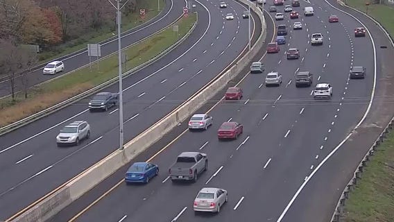 Dump truck strikes overhead highway sign, causing major impact