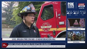 Multiple homes evacuated after brush fire on I-5 spreads to nearby neighborhood