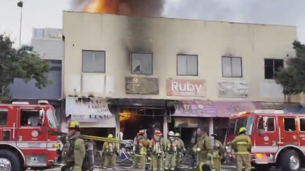 LAFD firefighters battle blaze at textile businesses