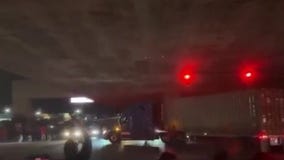 Oakland sideshow crowd cheers big rig driver