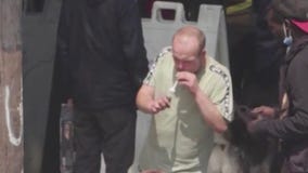 Homeless walking out of nonprofit with crack pipe