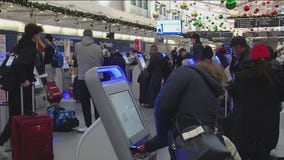 Holiday travelers in Chicago rush to beat the storm