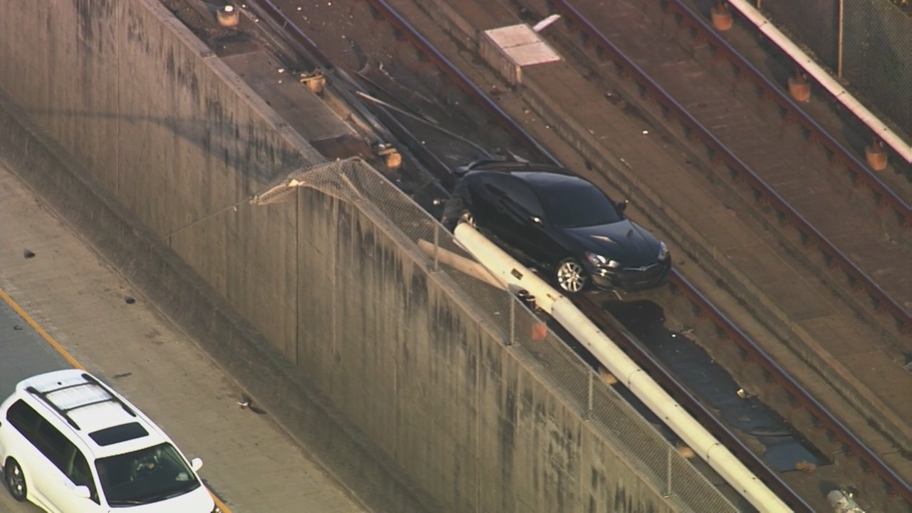 Car pushed on BART train tracks along I-580 in Castro Valley