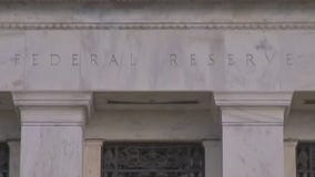 Fed holds interest rates steady to end 2023