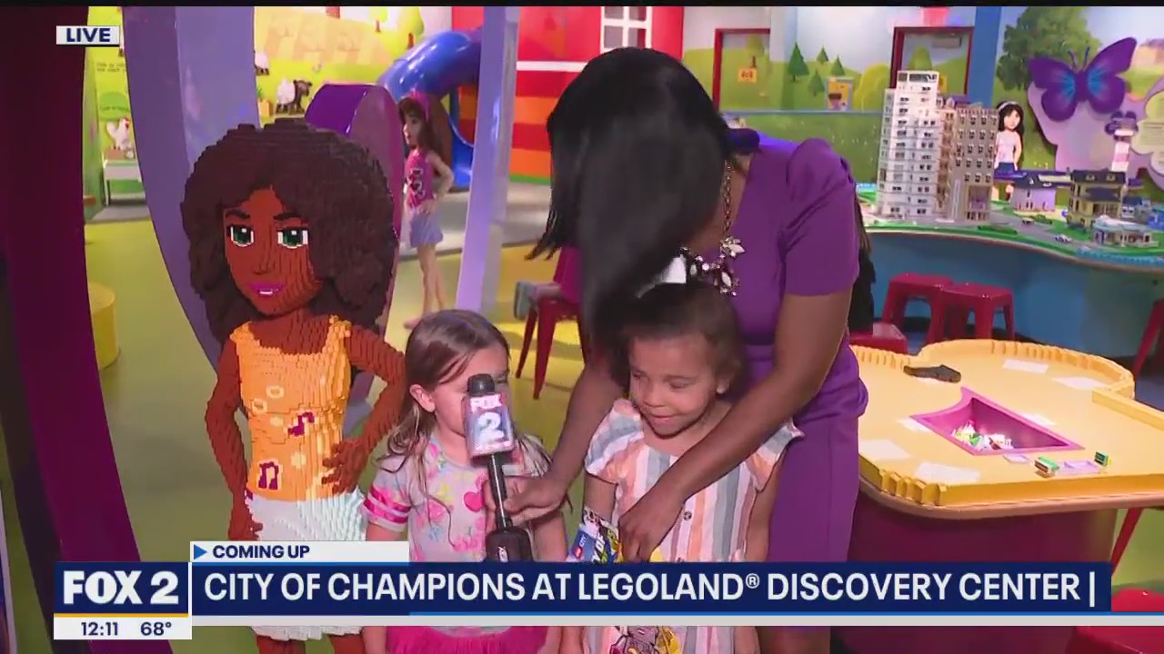 Whoops! Liz mistakenly hits girl with mic at LEGOLand