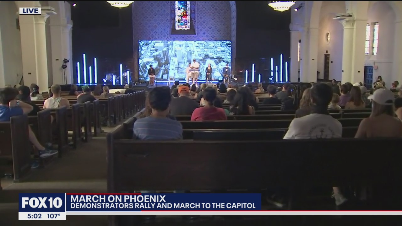 Demonstrators prepare to march to the Arizona State Capitol