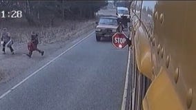 Pickup truck narrowly misses kids getting off school bus in Minnesota