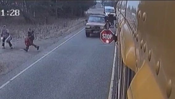 Pickup truck narrowly misses kids getting off school bus in Minnesota