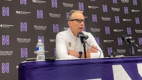 Chris Holtmann and Chris Collins talk after Northwestern's 84-64 win over DePaul