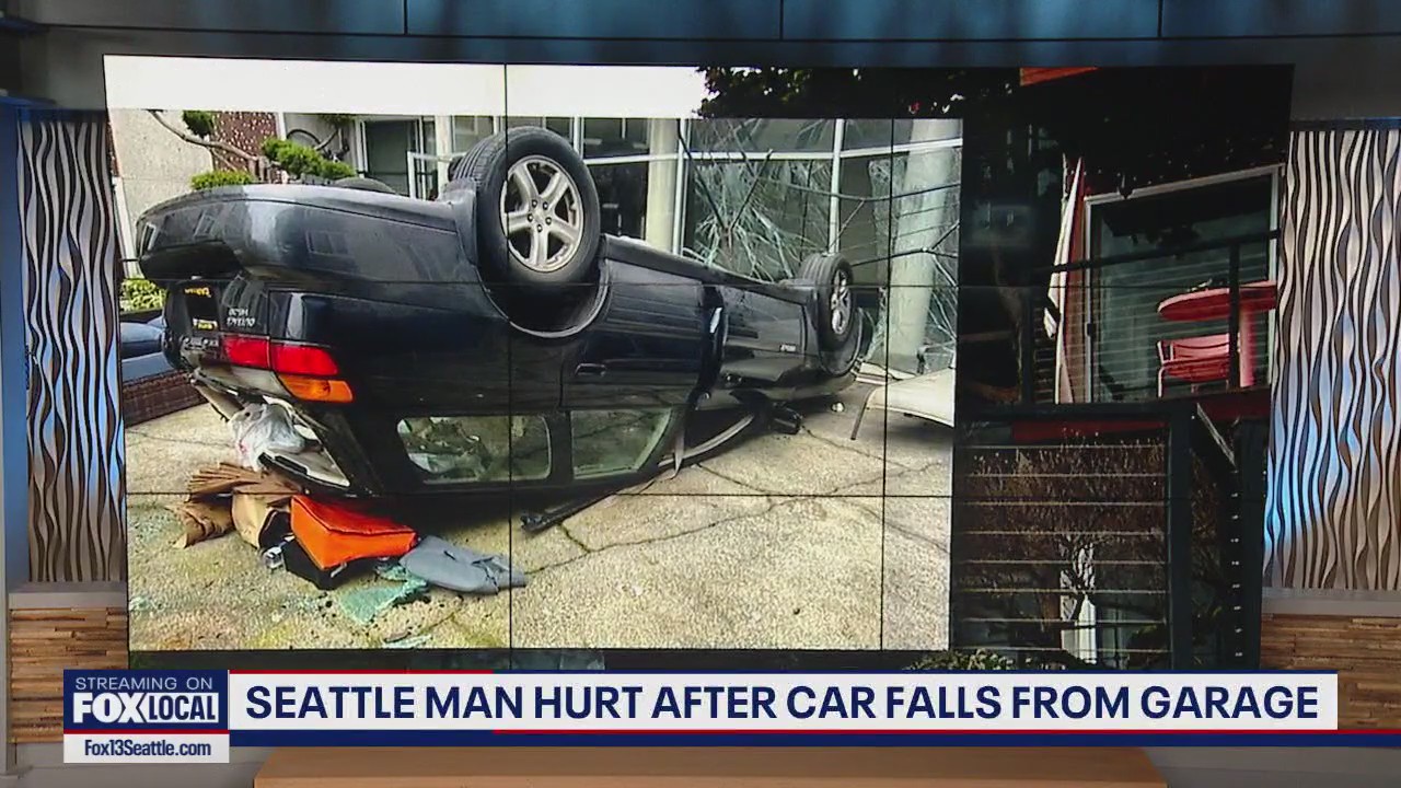 Seattle driver falls off multi-story parking garage, 77-year-old rescued