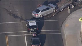 Driver looking at phone T-bones ASU officer