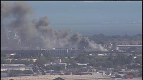Firefighters working to contain blaze near the Port of Oakland
