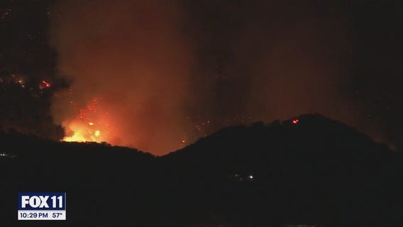 Chopper nails water drop over Palisades fire