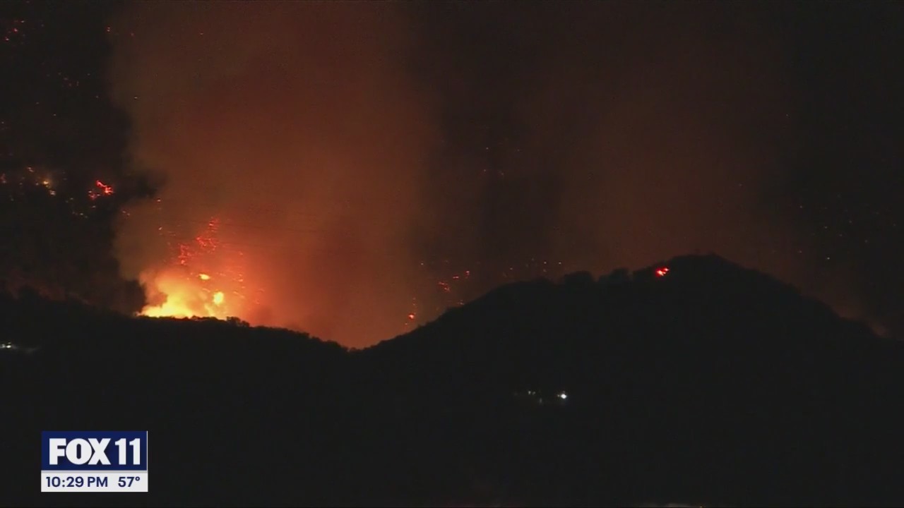Chopper nails water drop over Palisades fire