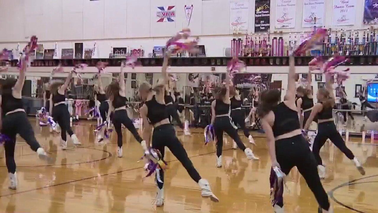 Local HS dance team performing in London parade