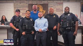 Blue Mound officers pull a driver from burning car