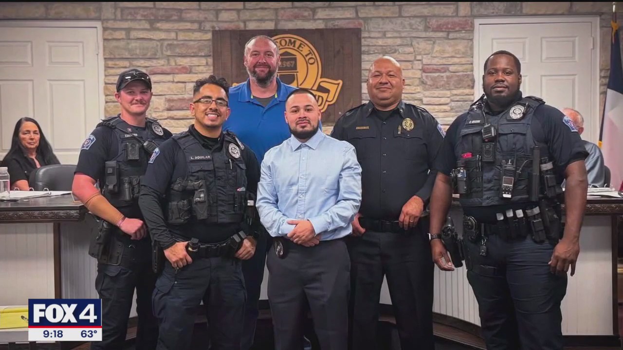 Blue Mound officers pull a driver from burning car