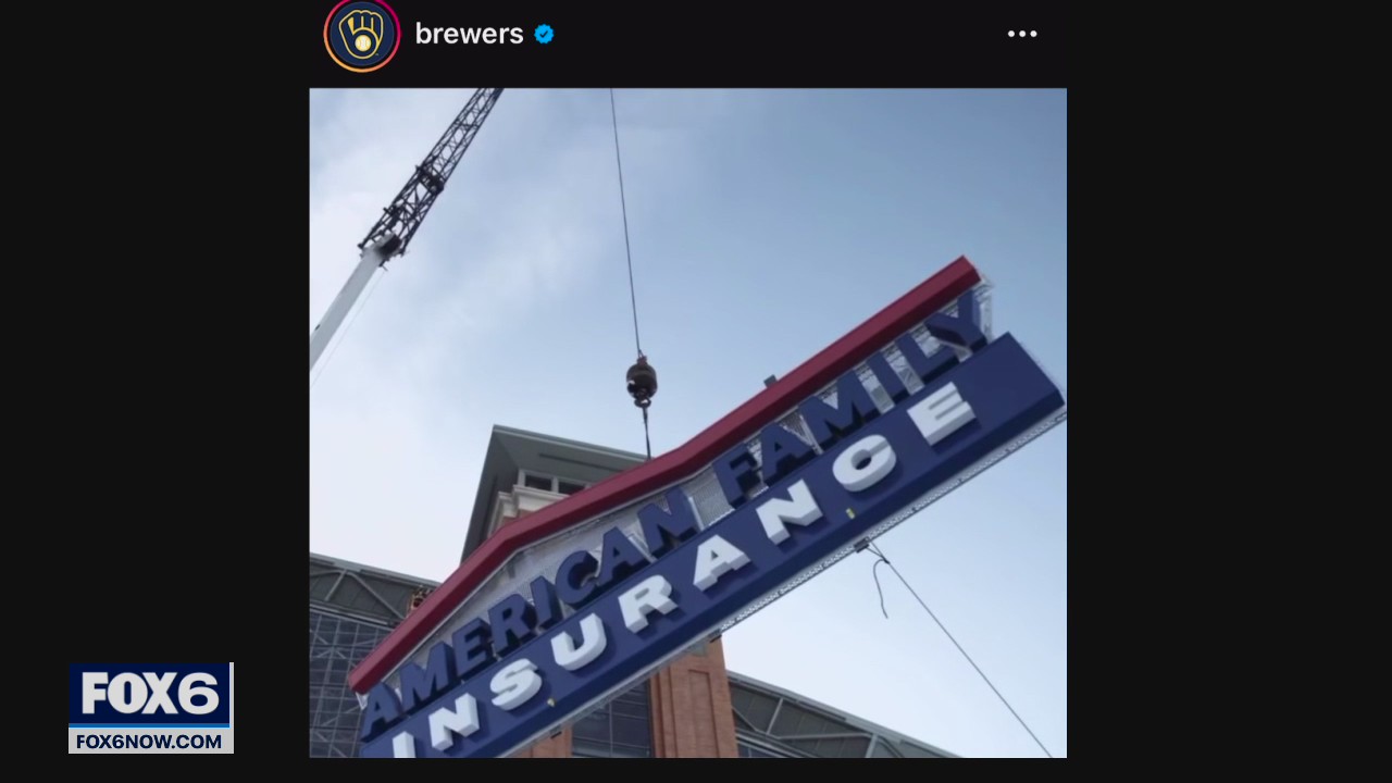 Crews work to place 52,000-pound sign on American Family Field