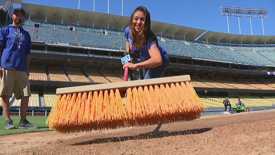 Ground crews prepare Dodger Stadium for Game 3 of NLCS