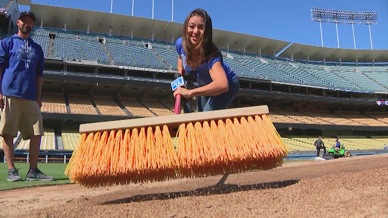 Ground crews prepare Dodger Stadium for Game 3 of NLCS