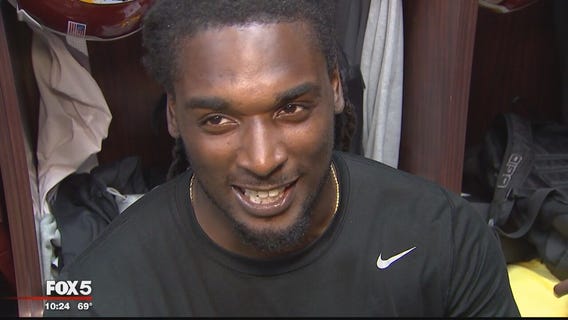 2 Redskins players at GameStop buy Xbox One for 10-year-old boy in Kaepernick jersey