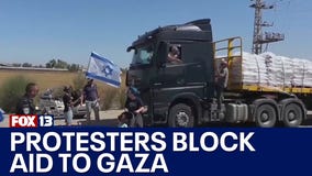 Protesters attempt to block humanitarian aid to Gaza