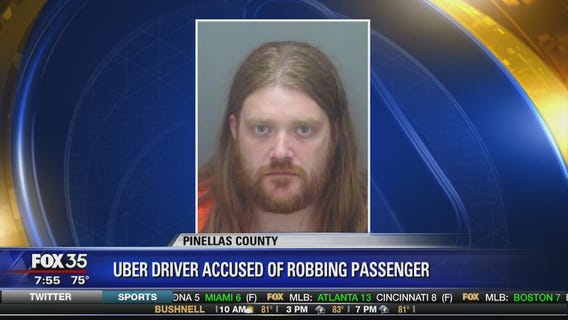 Uber driver accused of robbing passenger