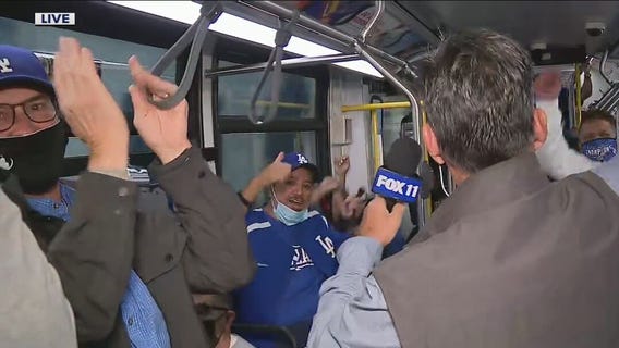 Fans break into 'Let's go Dodgers!' chant in bus ride to NLDS Game 4