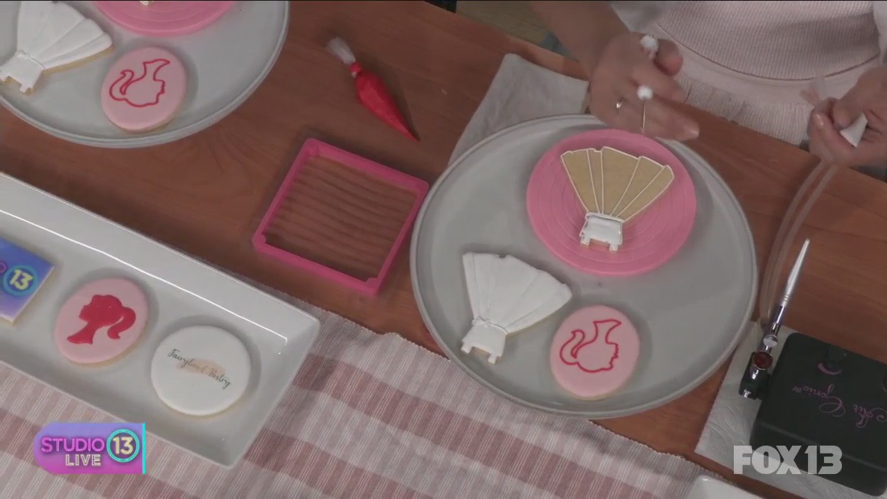 Learning how to decorate Barbie-inspired cookies