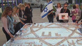 Jewish community light Shabbat candles for victims, hostages