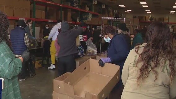 Long lines for Thanksgiving food giveaways show increased need