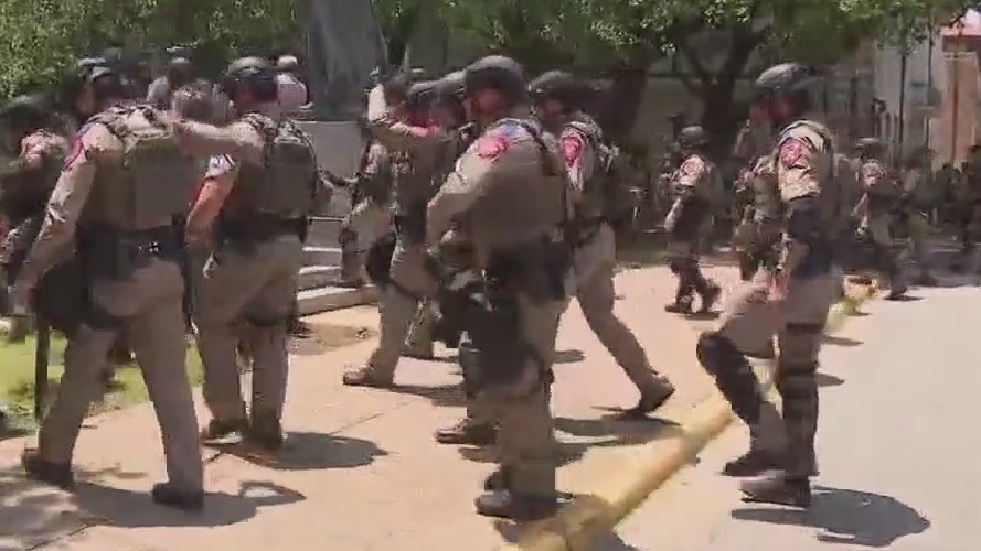 Man arrested for bringing gun to protest