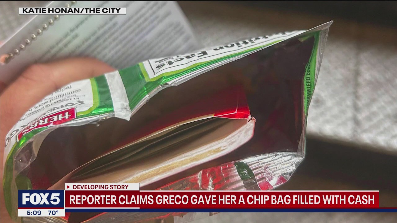 Former Adams advisor gives reporter cash stuffed in bag of potato chips