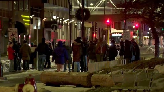 Protesters gather at Minneapolis City Hall after woman killed by ICE agent