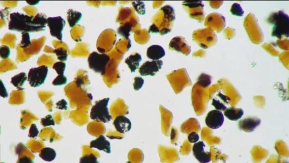 Why is the moon covered in orange glass beads?