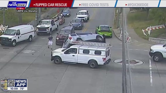 Football players rescue person in car flipped on side