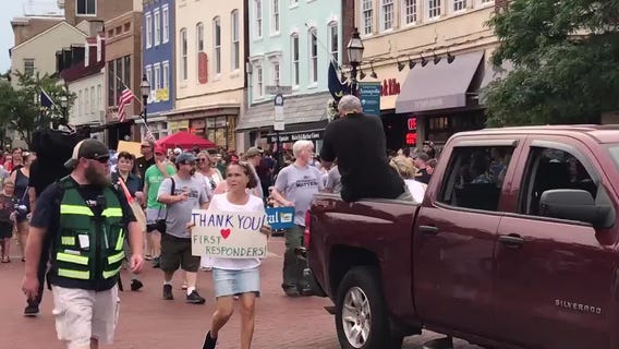 Capital Gazette survivors and families march in Annapolis July Fourth Parade