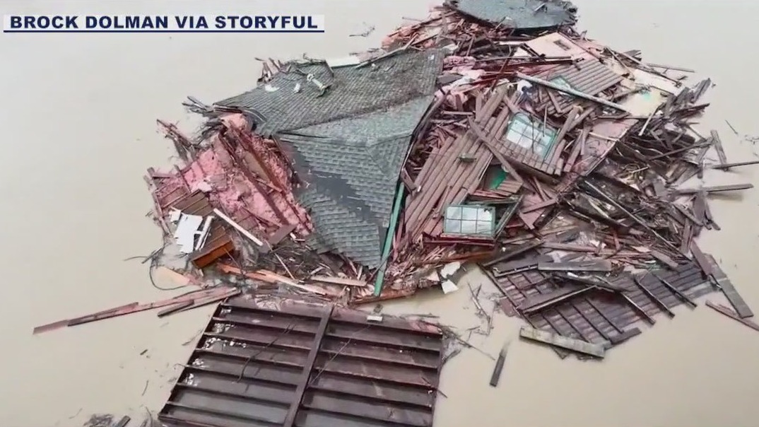 House destroyed in landslide floats down river