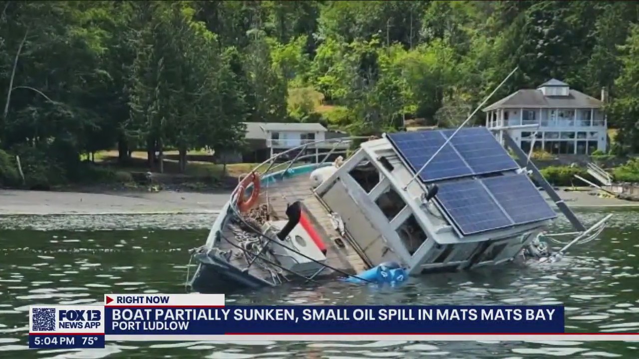 Boat partially sunken in Port Ludlow