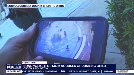 Surveillance video shows person pushing child underwater