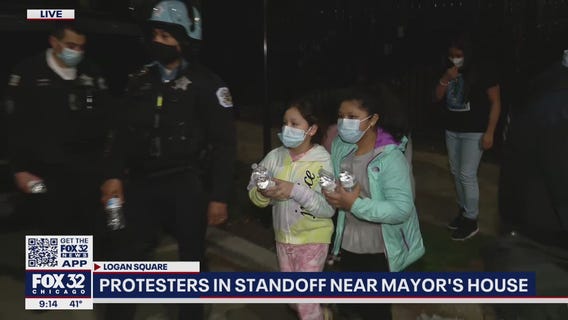 Kids give water bottles to Chicago police during Adam Toledo protest