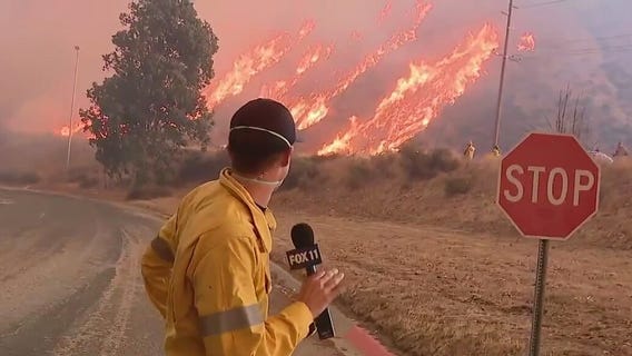 Hughes Fire races up hillside in seconds