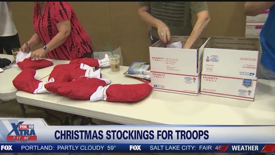 Volunteers stuff stockings for troops overseas