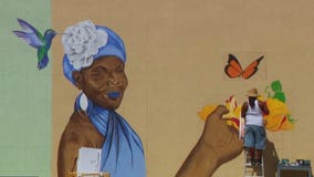 Artist begins new mural in north Minneapolis